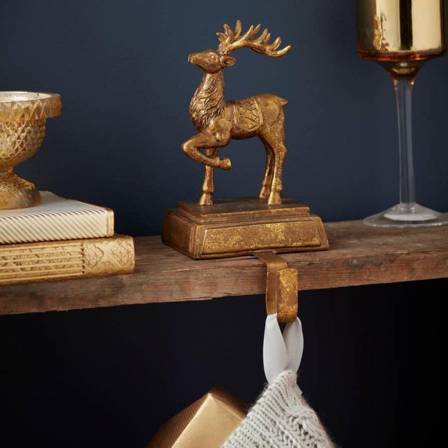 The Contemporary Home gold reindeer stocking hanger